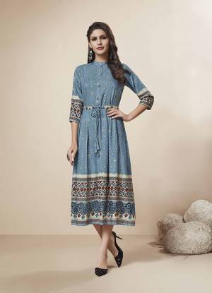 Grab This Very Pretty Readymade Kurti In Blue Color Fabricated On Rayon. This Pretty Kurti Is Beautified With Prints And Foil Print All Over.