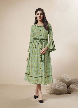 Look Pretty In This Lovely Designer Readymade Kurti In Light Green Color Fabricated On Rayon. This Kurti IS Beautified With Prints And Also Has Foil Print All Over It. 