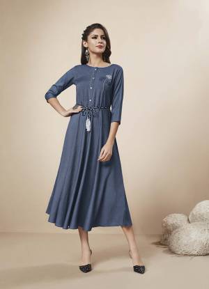You Will Definitely Earn Lots Of Compliments Wearing This Rich And Elegant Looking Designer Readymade Kurti In Dark Blue Color Fabricated On Rayon Denim. It Is Beautified With Pretty Thread And Stone Work. 
