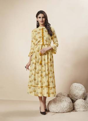 Simple And Elegant Looking Readymade Designer Kurti Is Here In Light Yellow Color Fabricated On Rayon. This Kurti Is Beautified With Prints And Also It Is Light In Weight And Easy To Carry All Day Long. 