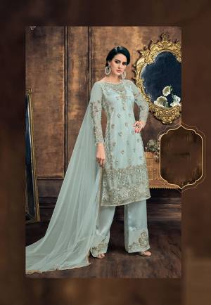 Grab This Heavy Embroidered Designer Straight Suit In Very Pretty And Unique Shade In Steel Blue Color. Its Top And Dupatta Are Fabricated On Net Paired With Satin Silk Fabricated Bottom. It Is Beautified With Embroidered Over And Bottom both. 