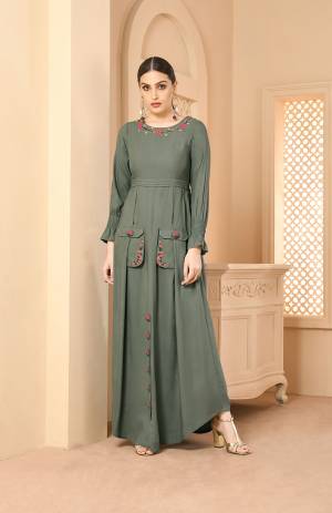 New And Unique Shade Is Here With This Designer Readymade Long Kurti In Teal Grey Color Fabricated On Rayon. It IS Beautified With Contrasting Thread Work Which Gives A Pretty Look To It. 