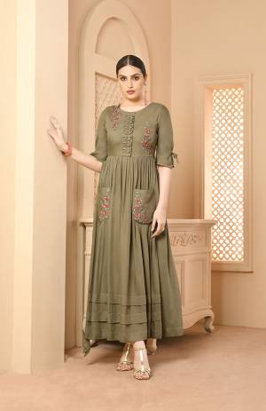 You Will Definitely Earn Lots Of Compliments Wearing This Designer Readymade Long Kurti In Light Olive Green Color Fabricated On Rayon. Its Fabric Is Soft Towards Skin And Easy To Carry All Day Long. 