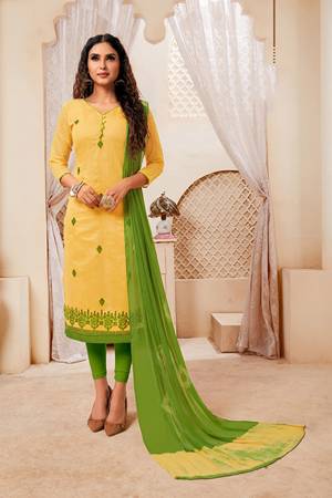 For Your Semi-Casual Wear, Grab This Dress Material And Get This Stitched As Per Your Desired Fit And Comfort. This Silk Based Top Is In Yellow Color Paired With Light Green Colored Cotton Based Bottom And Chiffon Dupatta. Buy Now.