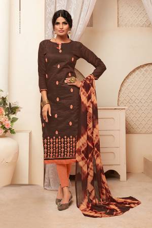 For Your Semi-Casual Wear, Grab This Dress Material And Get This Stitched As Per Your Desired Fit And Comfort. This Silk Based Top Is In Brown Color Paired With Dark Peach Colored Cotton Based Bottom And Chiffon Dupatta. Buy Now.