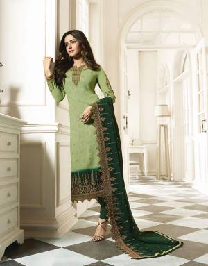Rich And Elegant Looking Heavy Embroidred Designer Straight Suit Is Here With A Pretty Digital Printed Inner Pattern. Its Top Is In Light Green Color Paired With Dark Green Colored Bottom And Dupatta. This Pretty Suit Is Georgette Based Paired With Santoon Fabricated Bottom. 