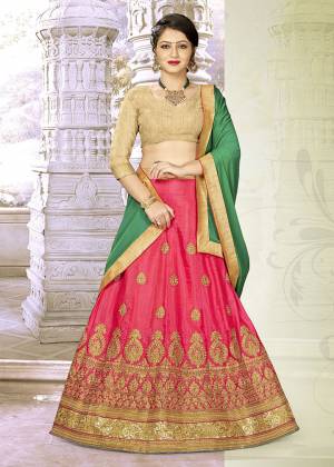 Add This Pretty Designer Lehenga Choli To Your Wardrobe In Golden Colored Blouse Paired With Rani Pink Colored Lehenga And Contrasting Green Colored Dupatta. Its Blouse Is Fabricated on Art Silk Paired With Satin Silk Lehenga And Chiffon Dupatta. All Its Fabrics Are Light Weight And Easy To Carry Throughout The Gala.