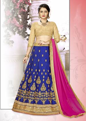 Add This Pretty Designer Lehenga Choli To Your Wardrobe In Golden Colored Blouse Paired With Royal Blue Colored Lehenga And Contrasting Rani Pink Colored Dupatta. Its Blouse Is Fabricated on Art Silk Paired With Satin Silk Lehenga And Chiffon Dupatta. All Its Fabrics Are Light Weight And Easy To Carry Throughout The Gala.