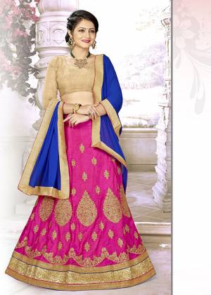 Grab This Beautiful Designer Lehenga Choli In Golden Colored Blouse Paired With Rani Pink Colored Lehenga And Contrasting Royal Blue Colored Dupatta. Its Blouse IS Silk Based Paired With Satin Silk Embroidered Lehenga And Chiffon Fabricated Dupatta. Buy Now.