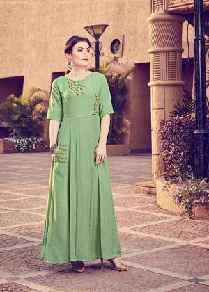 Get For The Upcoming Festive Season With This Readymade Kurti In Green Color. This Pretty Kurti Is Beautified With Minimal Hand Work And Available In All Regular Sizes. 