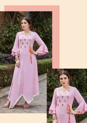 For Your Semi-Casuals Or Social Gatherings, Grab This Designer Readymade Kurti In Pink Color. It Has Pretty Attractive Hand Work Which Gives A Rich And Elegant Look Over All. Buy Now.