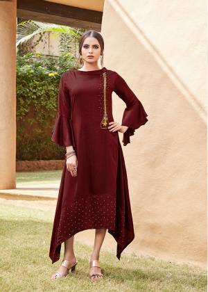 Get For The Upcoming Festive Season With This Readymade Kurti In Maroon Color. This Pretty Kurti Is Beautified With Minimal Hand Work And Available In All Regular Sizes. 