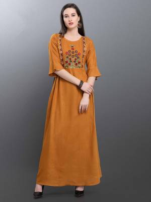 Celebrate This Festive Season With Beauty And Comfort Wearing This Designer Readymade Long Kurti In Musturd Yellow Color Fabricated On Cotton Blend Beautified With Thread Work. It Is Available In All Regular Sizes. Buy Now.