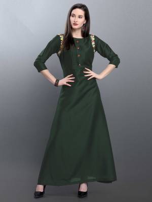 Grab This Deisgner Readymade Long Kurti In Forest Green Color Fabricated On Muslin. This Kurti Is Beautified With Hand Work Near Arm Hole. Buy This Pretty Piece Now.