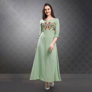 This Season Is About Subtle Shades And Pastel Play, So Grab This Designer Readymade Kurti In Pastel Green Color Fabricated On Rayon Slub. This Fabric IS Soft Towards Skin Which Ensures Superb Comfort All Day Long. 