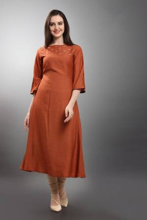 New Shade Is Here To Add Into Your Wardrobe With This Designer Readymade Kurti In Rust Orange Color. This Silk Based Kurti Is Beautified With Small Butti Work. And It Is Easy To Carry And Durable. 