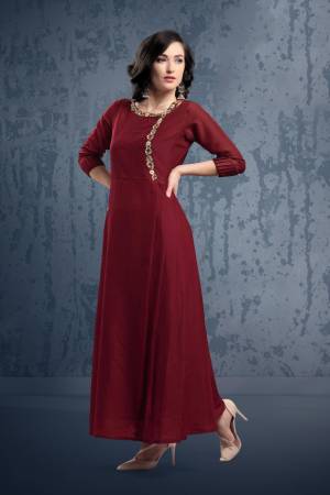 Enhance Your Personality Wearing This Designer Long Kurti In Maroon Color. This Muslin FabricatedReadymade Kurti Is Beautified With Hand Work Giving It An Attractive Look. Buy Now.