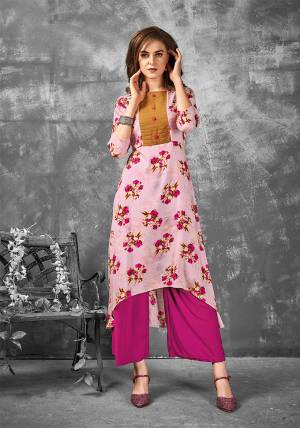 Look Pretty In This Readymade Kurti In Pink Color Fabricated On Rayon. It Is Beautified With Bold Floral Prints All Over It. Buy Now.