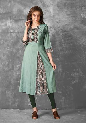 For Your Semi-Casual Wear, Grab This Very Pretty Readymade Kurti In Sea Green Color Fabricated Rayon Slub. It IS Beautified With Pretty Prints And Available In Regular Sizes. 