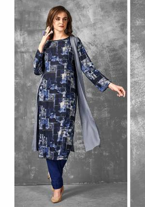 Enhance Your Pesonality In This Readymade Printed Kurti In Navy Blue Color Fabricated on Cotton. It Is Light In Weight And Easy To Carry All Day Long. 
