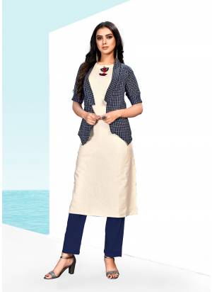 Simple And Elegant Looking Designer Readymade Kurti Is Here In Off-White & Navy Blue Color Fabricated On Khadi Cotton. It IS Beautified With Checks Prints And Fancy Buttons.