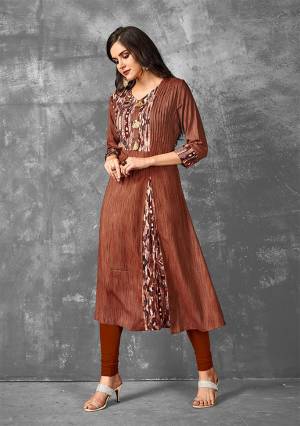 Enhance Your Personality Wearing This Readymade Kurti In Brown Color Fabricated On Rayon. Its Fabric Is Soft Towards Skin And Easy To Carry All Day Long. 