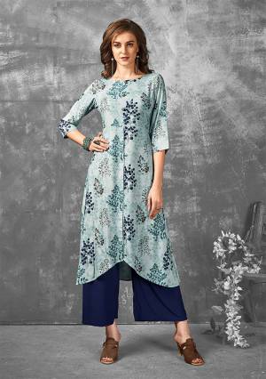 Look Pretty In This Designer Readymade Kurti In Sky Blue Color Fabricated On Rayon. It Is Beautified With Prints In Multiple Shades Of Blue. It Is Light Weight, Durable And Easy To Carry All Day Long. 