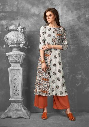 Enhance Your Personality Wearing This Readymade Kurti In Off-White Color Fabricated On Rayon. Its Fabric Is Soft Towards Skin And Easy To Carry All Day Long. 