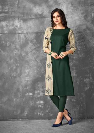 Here Is A Very Beautiful Designer Straight Kurti In Dark Green And Beige Color Fabricated On Rayon. This Readymade Kurti Is Available In all Regular Sizes And Ensures Superb Comfort All Day Long. 