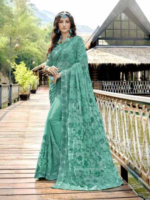 You Will Definitely Earn Lots Of Compliments Wearing This Heavy Designer Saree In Sea Green Color Paired With Sea Green Colored Blouse. This Saree And Blouse Are Georgette Fabricated Beautified With Heavy Tone To Tone Embroidery. 