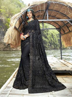 You Will Definitely Earn Lots Of Compliments Wearing This Heavy Designer Saree In Black Color Paired With Black Colored Blouse. This Saree And Blouse Are Georgette Fabricated Beautified With Heavy Tone To Tone Embroidery. 