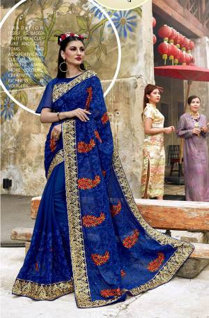 Adorn the Pretty Angelic Look In This Attractive Heavy Designer Saree In Royal Blue Color Paired With Royal Blue Colored Blouse. This Saree And Blouse Are Fabricated On Georgette Beautified With Heavy Embroidery. 