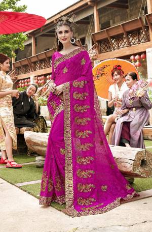 Enhance Your Personality Wearing This Very Beautiful Heavy Designer Saree In Dark Pink Color Paired With Dark Pink Colored Blouse. This Saree And Blouse Are Georgette Based Beautified With Heavy Embroidery. 
