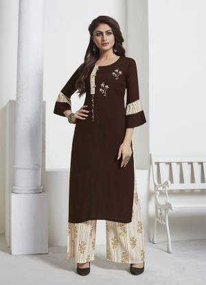 Enhance Your Personality Wearing This Readymade Pair In Brown Colored Kurti Paired with Contrasting Cream Colored Bottom. Its Top Is Fabricated On Rayon Slub Paired With Rayon Fabricated Bottom. Its Bottom And Pretty Foil Prints And Hand Work On Kurti. Buy Now.