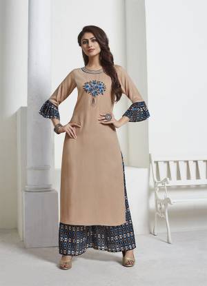 Simple and Elegant Looking Designer Readymade Pair Is Here In Beige Colored Top Paired With Black And Blue Colored Bottom. This Kurti Is Fabricated On Rayon Slub Paired With Silk Based Bottom. Buy Now.
