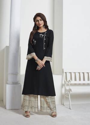 For A Bold And Beautiful Look, Grab This Designer Readymade Pair Of Kurti And Pant In Black And Cream Color. Its Top IS Fabricated On Rayon Slub Paired With Muslin Fabricated Bottom. Grab This Lovely Rich and Elegant Looking Piece Now.