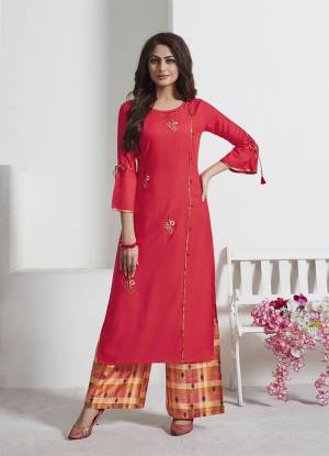 Attract All Wearing This Readymade Pair Of Kurti And Pants In Crimson Red Colored Top Paired With Multi Colored Bottom. Its Top Is Fabricated On Rayon Slub Paired With Soft Silk Fabricated Bottom. Both Its Fabric Are Light Weight And Easy To Carry All Day Long. 
