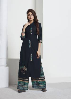 For Your Semi-Casual Or Social Gatherings, This Lovely Pair Of Kurti And pants Is Here In Navy Blue Colored Top Paired With Multi Colored Bottom. This Pair Is Rayon Based Beautified With Prints And Thread Work. Buy Now.