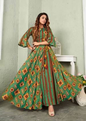 Here Is A Very Pretty Designer Readymade Gown In Green And Brown Color Which Is Fabricated On Muslin And Beautified With Prints All Over. This Gown Is Light Weight And easy To Carry Throughout The Gala. 