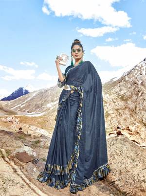 Get Ready For The Next Party At Your Place With This Designer Saree In Navy Blue Color Paired With Navy Blue Colored Blouse. This Saree Is Lycra Based Paired With Art Silk Fabricated Blouse. Also It Is Light In Weight And Easy To Carry Throughout The Gala.