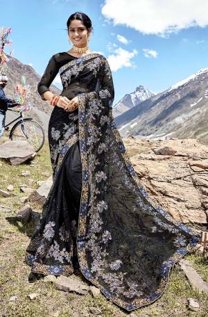 Here Is A Bold And Beautiful Looking Heavy Designer Saree In Black Color Paired With Black Colored Blouse. This Saree And Blouse Are Net Based Beautified With Heavy Jari And Thread Work. Buy This Beautiful Saree Now.