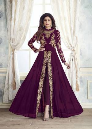 Enhance Your Personality Wearing This Designer Indo-Western Dress In Wine Color With Fornt Slit Pattern And Straight Pants. Its Heavy Embroidered Top Is Fabricated On Georgette Paired With Santoon Bottom And Chiffon Fabricated Dupatta. All Its Fabrics Are Light Weight , Durable And Esnures Superb Comfort Throughout The Gala. Buy Now.