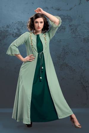 Here Is A Very Beautiful Designer Kurti With Jacket Is Here In Pine And Pastel Green Color. Is IS Fabricated On Muslin Which IS Soft Towards And Is Beautified With Minimal Hand Work Giving It An Elegant Look. 