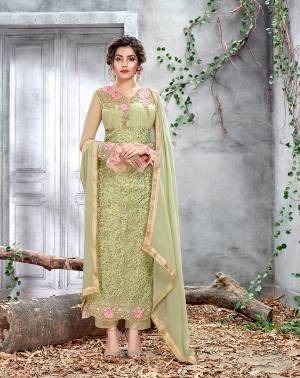 Celebrate This Festive And Wedding Season With This Very Beautiful Designer Straight Suit In Pastel Green Color. Its Embroidered Top Is Net Based Paired With Santoon Bottom And Chiffon Fabricated Dupatta. All Its Fabrics Are Light Weight And Easy To Carry All Day Long. 
