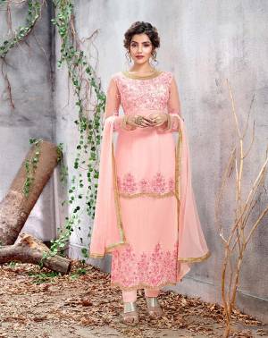 Look Pretty In This Very Beautiful Designer Straight Suit In Light Pink Color Paired With Light Pink Colored Bottom And Dupatta. Its Top Is Net Based Paired With Santoon Bottom And Chiffon Fabricated Dupatta. It Is Beautified With Very Pretty Tone To Tone Embroidery Which Gives A Subtle Look To It. 