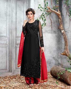 Evergreen Combination Is Here With This Designer Straight Cut Suit In Black Colored Top Paired With Red Colored Bottom and Dupatta. Its Heavy Tone To Tone Embroidered Top Is Fabricated On Net Paired With Santoon Bottom And Chiffon Fabricated Dupatta. 