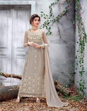 Flaunt Your Rich And Elegant Taste Wearing This Heavy Designer Straight Suit In Light Grey Color. Its Top Is Fabricated On Net Paired With Santoon Bottom And Chiffon Fabricated Dupatta. It Is Beautified With Pretty Elegant Embroidery Which Will Earn You Lots Of Compliments From Onlookers. 