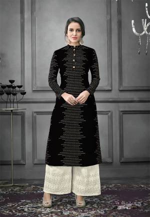 Enhance Your Personality Wearing This Designer Readymade Pair In Kurti And Plazzo. This Pretty Foil Printed Kurti Is In Black Color Fabricated On Art Silk Paired With Cotton Fabricated Thread Embroidered Bottom. Both The Top And Bottom are Fully Stitched And Available In All Sizes. 