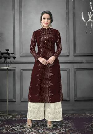 Enhance Your Personality Wearing This Designer Readymade Pair In Kurti And Plazzo. This Pretty Foil Printed Kurti Is In Maroon Color Fabricated On Art Silk Paired With Cotton Fabricated Thread Embroidered Bottom. Both The Top And Bottom are Fully Stitched And Available In All Sizes. 