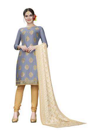 This Festive Season, Adorn A Rich, Simple And Elegant Look With This Dress Material In Dark Grey Colored Top Paired With Beige Colored Bottom And Cream Colored Dupatta. This Dress Material Is Cotton Based Beautified With Jari Embroidered Butti. Get This Stitched As Per Your Desired Fit And Comfort. 